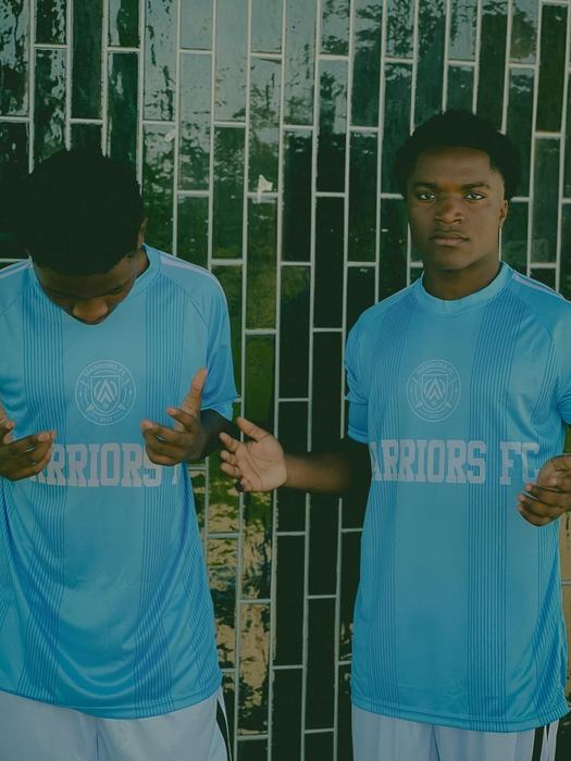 Players wearing Warriors FC training kit